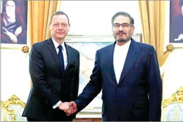  ?? ATTA KENARE/AFP ?? Ali Shamkhani (right), the secretary of the Supreme National Security Council of Iran meets with Emmanuel Bonne, diplomatic adviser to the French president, in Tehran on Wednesday.