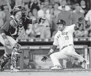  ?? Karen Warren / Houston Chronicle ?? Yulieski Gurriel comes home on a hit by Alex Bregman, who made a splashy return to action with a pinch-hit single during the Astros’ six-run sixth inning Tuesday night.