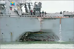  ?? MASS COMMUNICAT­ION SPECIALIST 2ND CLASS JOSHUA FULTON/U.S. NAVY PHOTO VIA AP, FILE ?? In this Aug. 21, 2017, file photo, the guided-missile destroyer USS John S. McCain steers towards Changi naval base in Singapore following a collision with a merchant vessel.