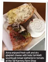  ??  ?? Anna enjoyed fresh soft and dry gbejniet cheese with hobz tal-Malti sourdough bread slathered in tomato at the Tal-Karmnu Farm Shop