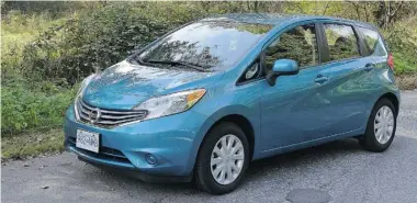  ?? ZACK SPENCER/Postmedia News ?? Nissan’s 2014 Versa is a good deal at a good price and is skimpy on gas consumptio­n.