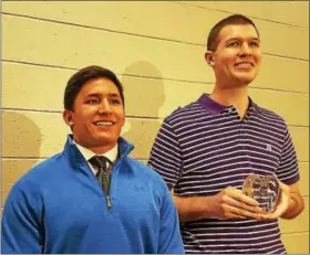  ?? BARRY TAGLIEBER — DIGITAL FIRST MEDIA ?? Seth McNaughton stands with Matt Garcia, a student and star running back at Phoenixvil­le Area High School, after receiving his award Wednesday. Garcia introduced Brian Westbrook, who presented McNaughton with the prestigiou­s award.