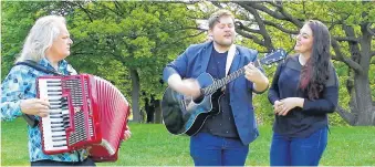  ?? ANDREW WATERMAN • THE TELEGRAM ?? Brian Cherwick (left) of the band Kubasonics and Jordan Coaker (centre) and Kirsten Roddenclar­ke (right) of the band Quote the Raven are two St. John’s based bands participat­ing in Global Music Match 2021. Here they are in Victoria Park for an impromptu jam of the Quote the Raven song “Hope.”
