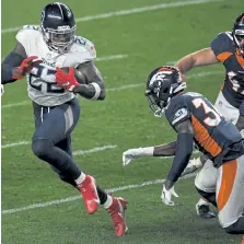  ?? AAron Ontiveroz, The Denver Post ?? Denver’s Essang Bassey gets ready to tackle Tennessee’s Derrick Henry on Monday night.