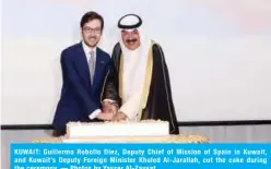  ??  ?? KUWAIT: Guillermo Robollo Diez, Deputy Chief of Mission of Spain in Kuwait, and Kuwait’s Deputy Foreign Minister Khaled Al-Jarallah, cut the cake during the ceremony. — Photos by Yasser Al-Zayyat