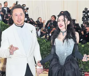  ?? ANGELA WEISS AFP/TRIBUNE NEWS SERVICE FILE PHOTO ?? Grimes and boyfriend Elon Musk recently welcomed their first child, who they named X Æ A-Xii. Now Grimes is selling a fraction of her soul as part of an art piece.