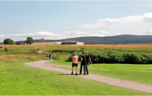  ??  ?? A path for walkers alongside poignant reminders of the past winds its way towards the Visitor Centre in the distance.