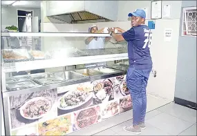  ?? ?? A customer being served food at the restaurant.