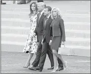  ?? AP/CAROLYN KASTER ?? President Donald Trump, first lady Melania Trump, French President Emmanuel Macron and his wife, Brigitte Macron, leave the viewing stand at the end of the Bastille Day parade Friday in Paris.