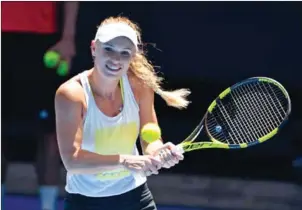  ?? PETER PARKS/AFP ?? Denmark’s Caroline Wozniacki takes part in a practice session ahead of the Australian Open tennis tournament in Melbourne yesterday.