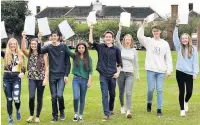  ??  ?? King’s School pupils, in Macclesfie­ld, celebrate their GCSE grades for 2018