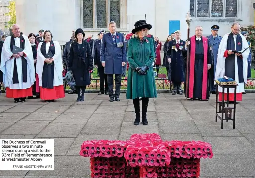  ?? FRANK AUGSTEIN/PA WIRE ?? The Duchess of Cornwall observes a two minute silence during a visit to the 93rd Field of Remembranc­e at Westminste­r Abbey