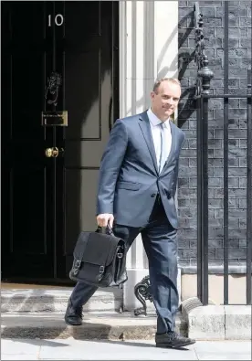  ?? PHOTO: BLOOMBERG ?? Dominic Raab, the Secretary of State for Exiting the EU, leaves 10 Downing Street, after meeting with British Prime Minister Theresa May in London yesterday. Brexiter Raab was named as Brexit secretary, replacing David Davis, the government says.
