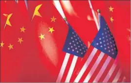  ?? AP ?? ■
In a file photo, China and US flags are seen displayed together, in Beijing.