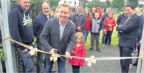  ??  ?? Orchard open Mark Millar cuts the ribbon at West End Park