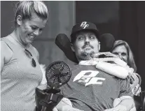  ?? THE ASSOCIATED PRESS ?? Pete Frates, right, who inspired the ice bucket challenge, looks at his wife Julie during a ceremony in Boston on Tuesday where the day was declared Pete Frates Day by Boston Mayor Marty Walsh.