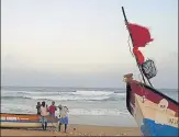  ?? AP ?? Fishermen carry their boat at Marina Beach in Chennai. n