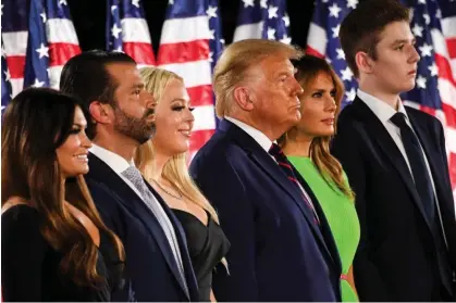  ?? Photograph: Saul Loeb/AFP/Getty Images ?? From left, Kimberly Guilfoyle, Donald Trump Jr, Tiffany Trump, Donald Trump, Melania Trump and Barron Trump at the White House on 27 August 2020.