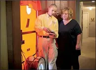  ?? Entergy Arkansas ?? A technician explains a blower door test to Entergy customer Cindy McKinnon of El Dorado. This type of test reveals the location of air leaks throughout the house.