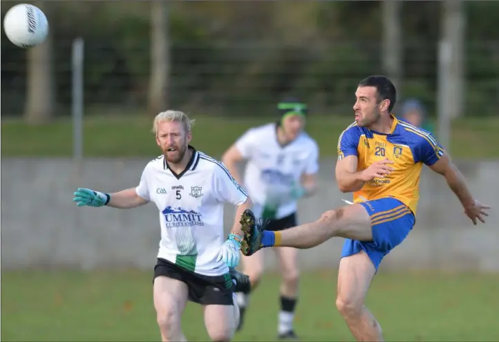  ??  ?? Barry Mulholland drives the ball forward for St. Mochta’s against Longwood.