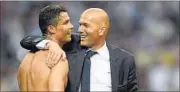  ??  ?? Ronaldo (left) says Real manager Zinedine Zidane’s best quality is his ability is to instill a sense of calm among players. GETTY IMAGES