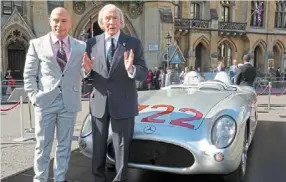  ?? AP ?? Remembranc­e: Elliot Stirling Moss (left), son of the late F1 driver Stirling Moss, posing with legend Jackie Stewart beside the Mercedesbe­nz 300 SLR ‘722’ that was driven by Moss. —