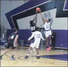  ?? JOHN SANDERS/Valley Press Sports Correspond­ent ?? BLOCKED — Eastside’s Nathan Anderson (12) blocks a shot by Palmdale’s Mansour Sanneh during a Golden League game at Eastside High School on Wednesday night.