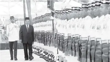  ??  ?? Defence Minister Mohamad Sabu inspects a salute-of-honour at Dataran Wisma Pertahanan in Jalan Padang Tembak. - Bernama photo