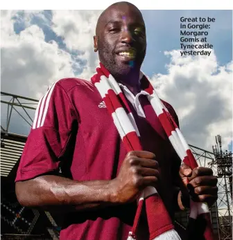  ??  ?? Great to be in Gorgie: Morgaro Gomis at Tynecastle yesterday