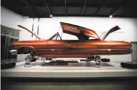  ??  ?? “El Rey,” a customized 1963 Chevrolet Impala by Albert de Alba Sr., is displayed at “The High Art of Riding Low” exhibition in Los Angeles.