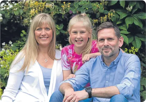  ??  ?? Bone damage took two inches off his height but Ian, pictured with Andrea and Sarah, has benefited from a clinical trial.