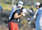  ?? CHRIS TILLEY/AP ?? LPGA players Amy Yang and Jin Young Ko rush to celebrate with Sei Young Kim after she won the CME Group Tour Championsh­ip Sunday at the Tiburón Golf Club in Naples.