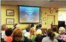  ?? Adrianna Hoff/Times Herald Staff ?? The audience at the town meeting in Lower Providence watches a video on the treatment of seizures Wednesday.