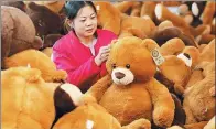  ?? SI WEI / FOR CHINA DAILY ?? A worker inspects toys at Dongsheng Toy Company in Ganyu, Jiangsu province. The company is an exporter to the European and US markets.