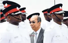  ?? FILE ?? National Security Dr Horace Chang inspecting a recent passing-out parade for new members of the JCF.