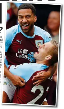  ??  ?? Clarets Cl t cuddle: ddl A Aaron L Lennon gets a hug from Matej Vydra
