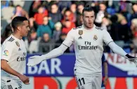  ?? Reuters ?? Real Madrid’s Gareth Bale celebrates with Lucas Vazquez after scoring their first goal. —