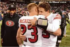  ?? Marcio Jose Sanchez / Associated Press ?? San Francisco running back Christian McCaffrey celebrates with quarterbac­k Brock Purdy after beating Seattle.