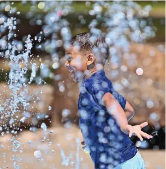  ?? ARKANSAS DEMOCRAT-GAZETTE FILE PHOTO ?? Christian Brown, 5, runs through the water while playing at the Riverfront Park splash pad in downtown Little Rock.