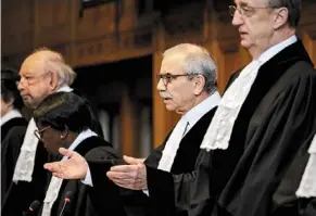  ?? ?? Grave case: ICJ president Nawaf Salam (centre) gesturing as he opens the ICJ hearing in a case filed by Nicaragua against Germany. — AFP