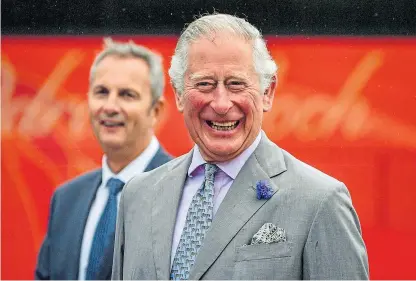  ?? Picture: PA. ?? The Prince of Wales reacts to a joke during his visit to Edwards Coaches in Mountain Ash.