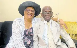  ?? PHOTO BY AINSWORTH MORRIS ?? Soon-to-be centenaria­n, retired Reverend William Anthony Edwards (right) with his wife, Fern, at the Mamby Park Baptist Church in St Andrew yesterday.