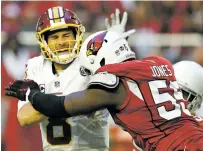  ?? ROSS D. FRANKLIN/ASSOCIATED PRESS FILE PHOTO ?? Washington Redskins quarterbac­k Kirk Cousins, left, takes a hit from Arizona Cardinals outside linebacker Chandler Jones in December during a game in Glendale, Ariz. Acquired in a trade with New England a year ago, Jones had 11 sacks, four forced fumbles, two fumble recoveries and 15 tackles for loss last season.