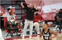  ?? NWA Democrat-Gazette/David Gottschalk ?? Q Arkansas women’s head basketball coach Mike Neighbors gestures at his team during a Jan. 28 game against the Connecticu­t Huskies at Bud Walton Arena. The team faces off against Wright State today at 1 p.m. in the NCAA Division I Women’s Basketball Tournament in Austin, Texas.