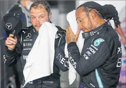  ?? ?? Lewis Hamilton (right) and team-mate Valtteri Bottas were feeling the heat after bagging first and third on the grid for today’s Grand Prix