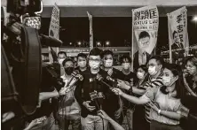  ?? Lam Yik Fei / New York Times ?? Ventus Lau, a candidate barred from running in the Hong Kong election, speaks to reporters Thursday. The government said Friday it will postpone the election until next year.