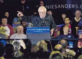  ?? Jae C. Hong Associated Press ?? “HOW ABOUT creating an economy that works for you, and not just the wealthy in this country?” Bernie Sanders asked his crowd at another venue in Clinton.