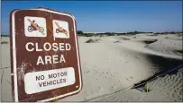  ?? ANNE WERNIKOF — CALMATTERS ?? A sign warns that motorcycle­s and off-road vehicles are banned along a cordoned-off portion of the dunes on Sept. 5.