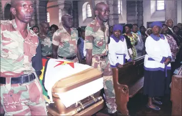  ??  ?? Zimbabwe National Army pallbearer­s carry the casket with the body of Cde Victoria Chitepo at the Anglican Cathedral during a funeral service in Harare yesterday. — (Picture by John Manzongo)