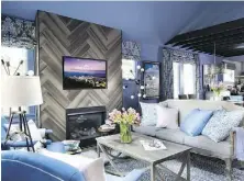  ?? SARAH DARIO/ SCRIPPS NETWORKS INTERACTIV­E ?? A living room designed by Brian Patrick Flynn for HGTV’s Urban Oasis 2015 house that had ceilings barely eight feet high and were raised as shown to create a dramatic open space.